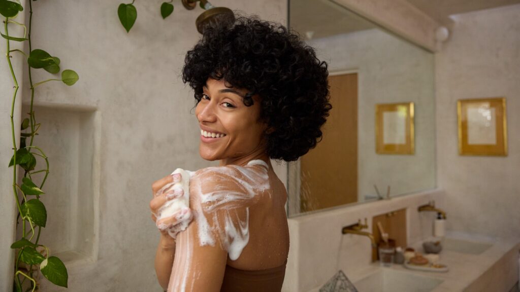 Woman using Dr. Bronner's Magic Bar Soap.