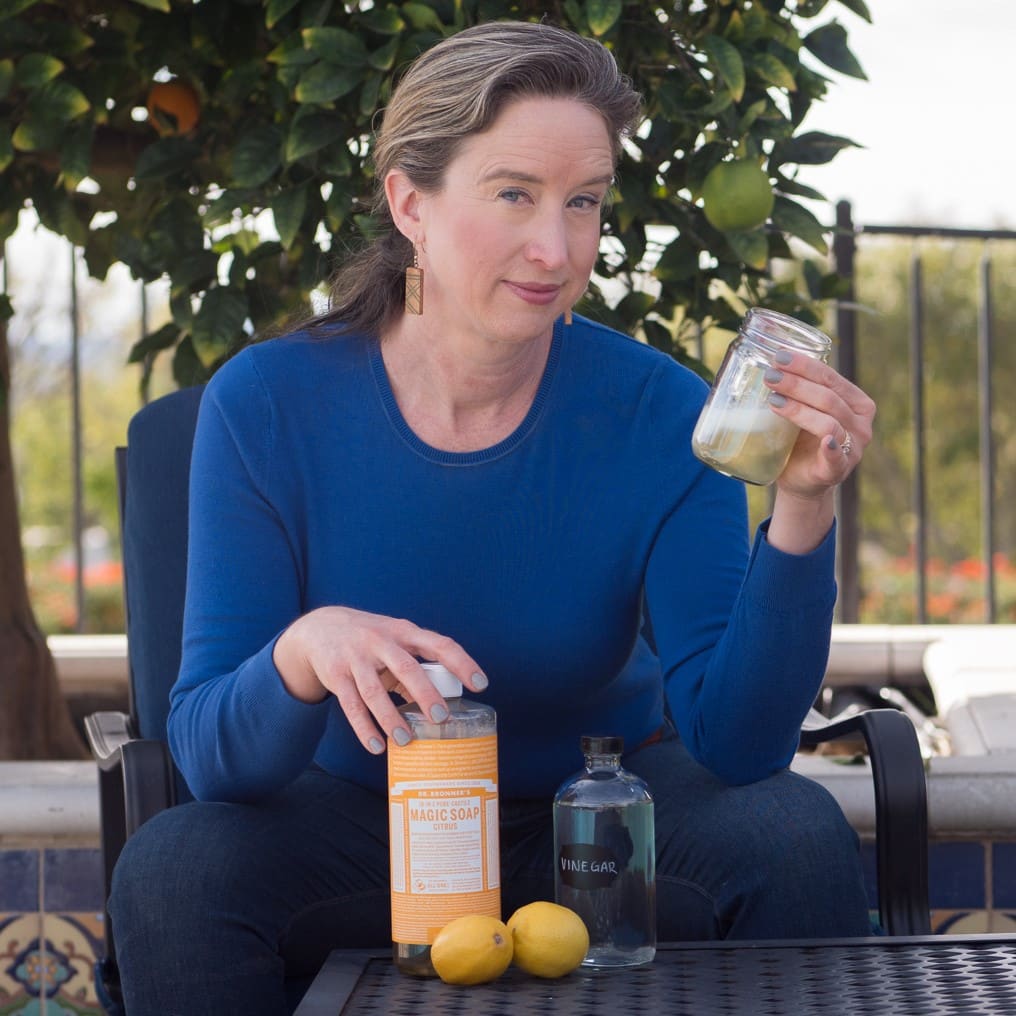 Lisa holding Castile Magic Soap and vinegar.