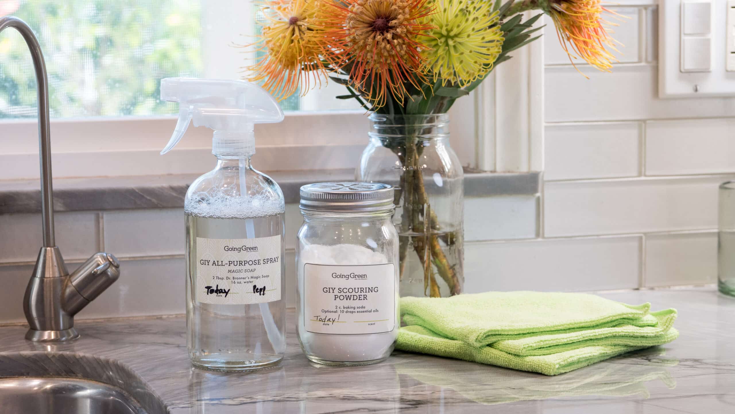 Bottle of All-Purpose Spray and jar of Baking Soda on counter.