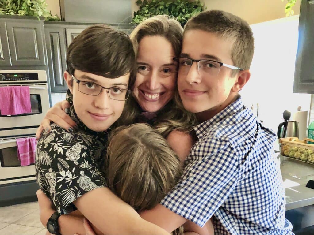 Lisa and kids hugging.