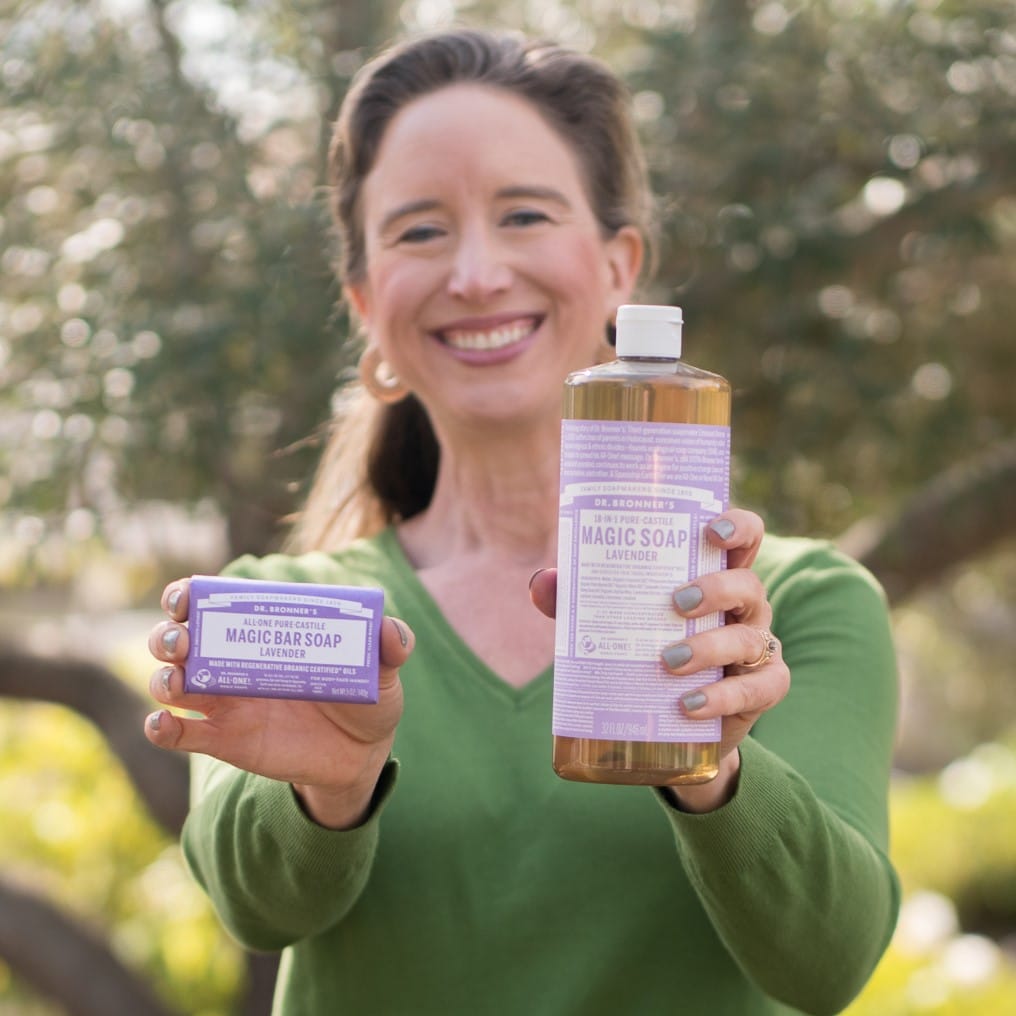 Lisa holding Dr. Bronner's Liquid Magic Soap and Bar Soap
