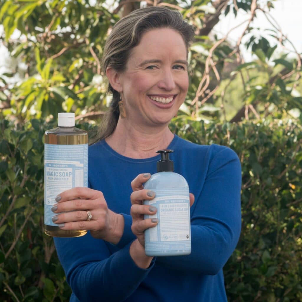 Lisa holding Dr. Bronner's Magic Soap and Sugar Soap