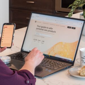 Lisa typing on EWG's site to look up personal care products.
