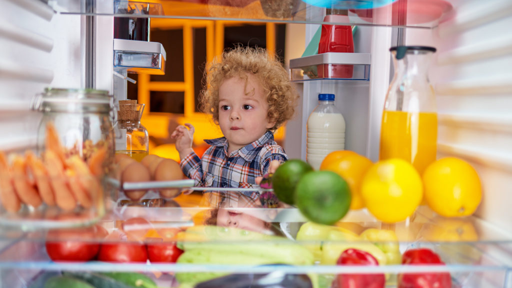 How to Clean Your Fridge - kid looking in fridge