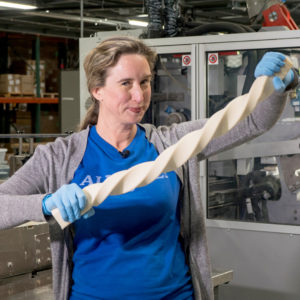 Lisa Bronner holding a twisted bar of Castile Bar Soap.