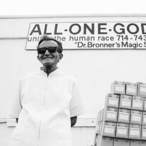 Black and white photo of Dr. Bronner in front of the soap factory - history of Dr. Bronner's