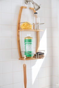 Dr. Bronner's Castile Soap in a shower caddy.