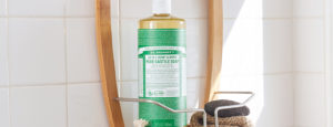 Dr. Bronner's Castile Soap in a shower caddy.