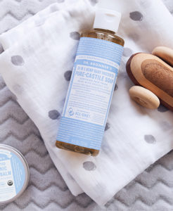 Dr. Bronner's Baby Unscented Castile Soap with baby items.