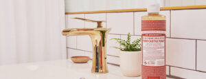 Castile Soap next to a bathroom faucet - green cleaning bathroom