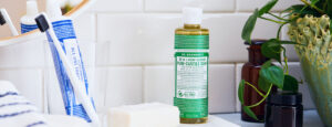 Dr. Bronner's Castile Soap and toothpaste on bathroom counter