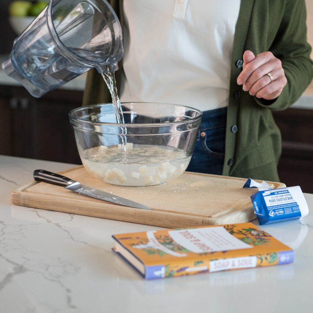 Making a green cleaning recipe with Lisa Bronner's book, Soap & Soul.