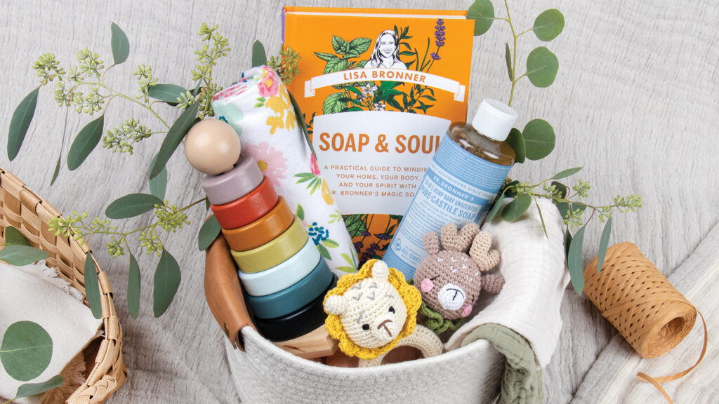 Soap & Soul book in a gift basket for baby and parent with blankets and toys and Castile Soap.