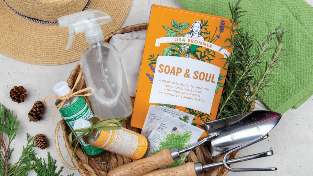 Soap & Soul book with gardening items: a trowel, seeds, soap, and a hat