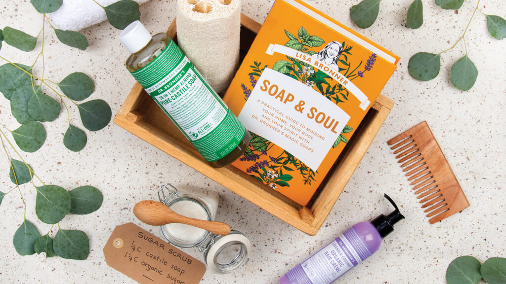Soap & Soul book in a body care basket with Castile Soap, lotion, sugar scrub