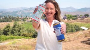 Lisa Bronner holding Dr. Bronner's Castile and Sal Suds.