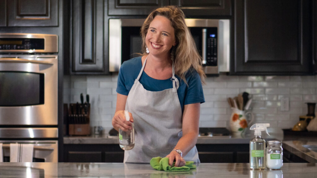 Lisa Bronner cleaning a kitchen counter