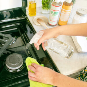 Cleaning a stove with Dr. Bronner's Sal Suds and Castile soap