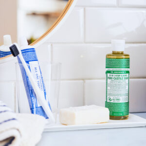 Dr. Bronner's Castile and Toothpaste on bathroom counter.