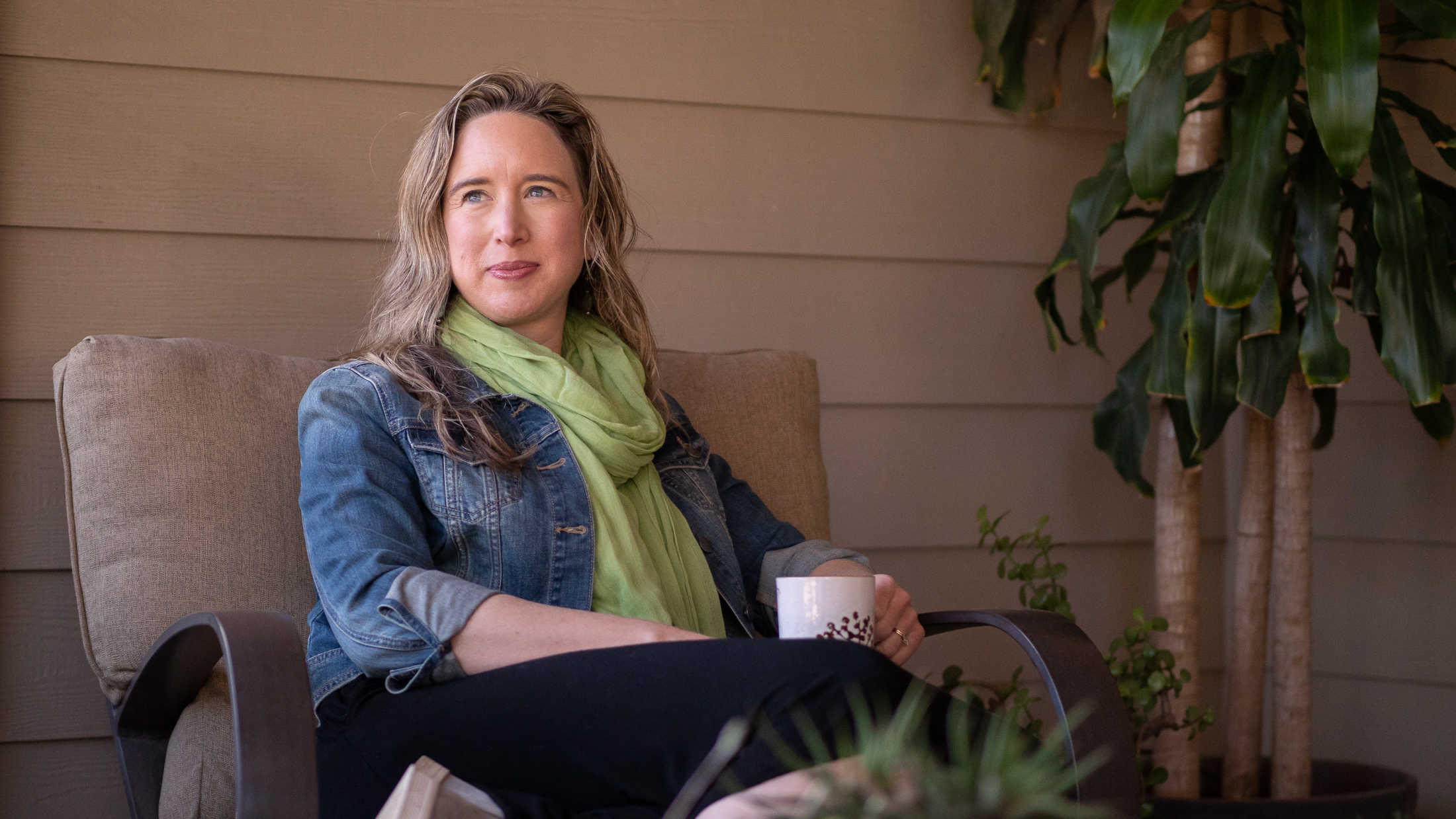 Lisa on her porch looking contemplative.