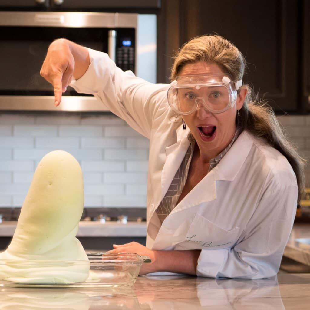 Lisa pointing at experiment with shock