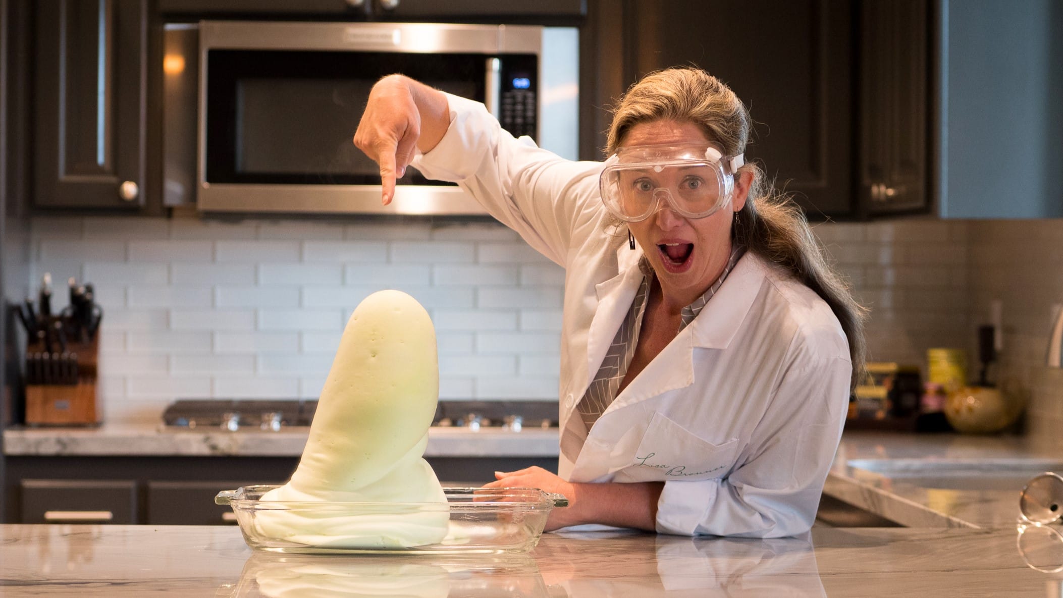 Lisa pointing at experiment with shock.