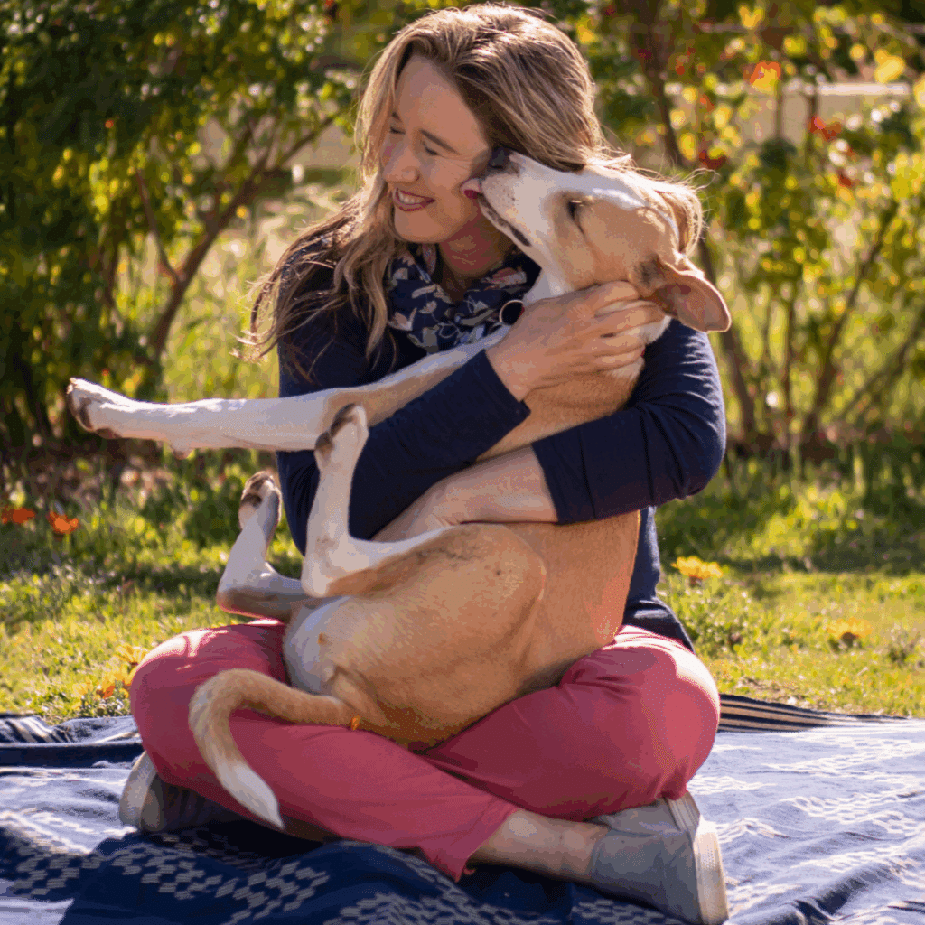 Lisa with her dog Sadie outside.