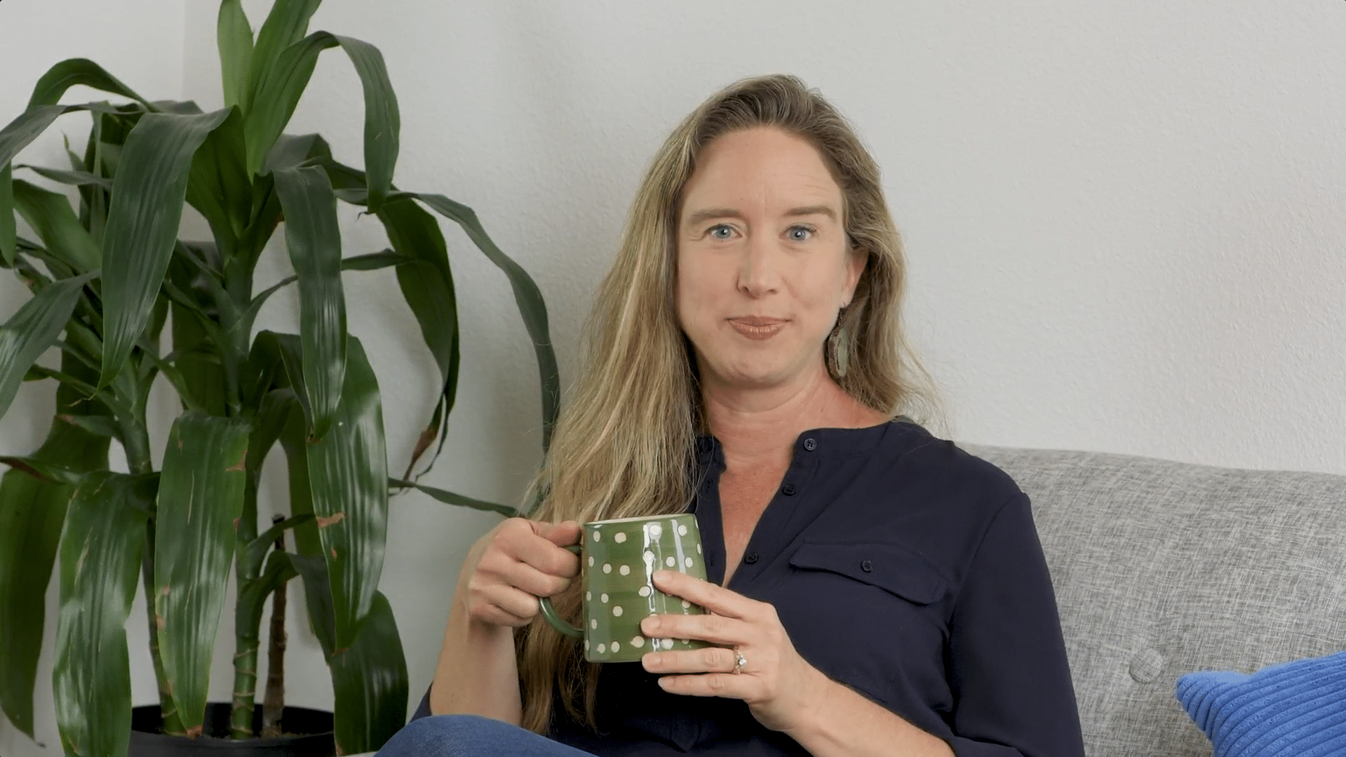 Lisa sitting with coffee mug