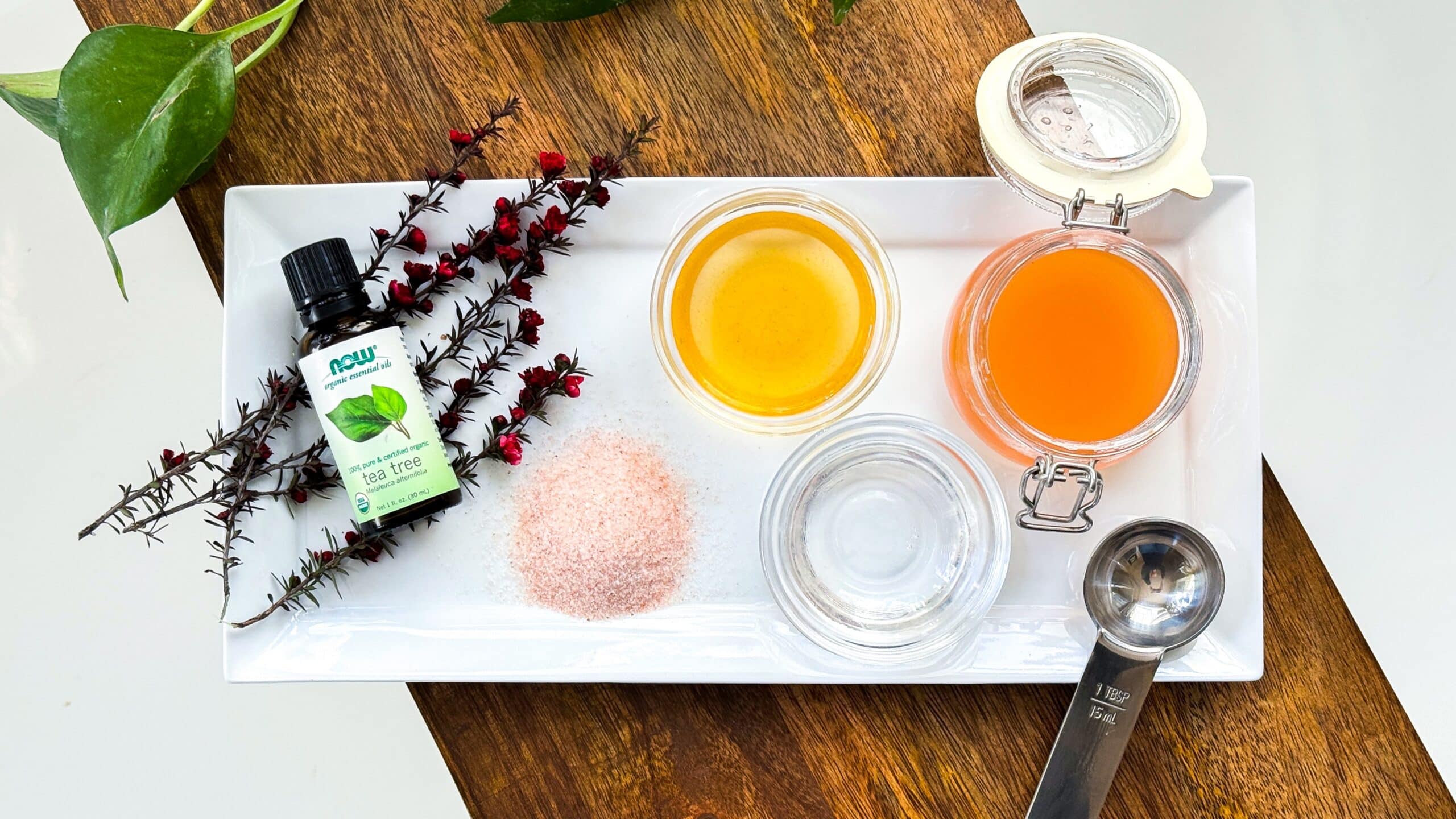 Ingredients for detox scalp scrub including Apple cider vinegar, glycerin, sea salt, and tea tree essential oil.