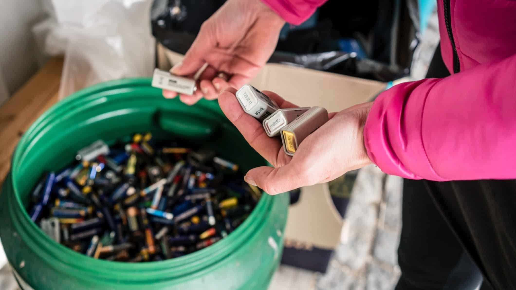 Person disposing of batteries.
